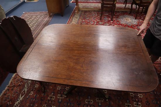 A George III mahogany and ebony strung tilt top breakfast table 143cm